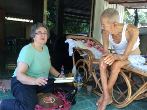 Katherine Bowie Interviewing Monk in Thailand