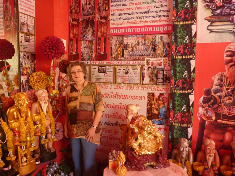 Katherine Bowie in Bangkok surrounded by images of the beggar Vessantara Jataka